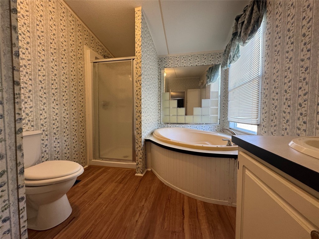 114 Speir Lane, Unit B Elgin, TX 78621 - Photo 11 of 11 a bathroom with a sink toilet and shower