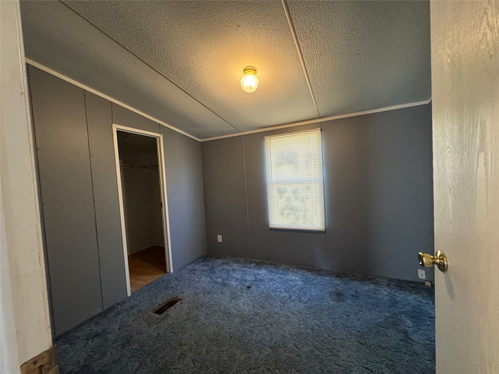 114 Speir Lane, Unit B Elgin, TX 78621 - Photo 7 of 11 a view of an empty room with a window