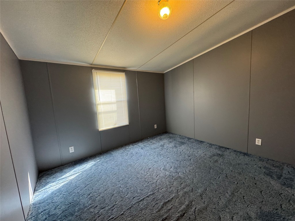 114 Speir Lane, Unit B Elgin, TX 78621 - Photo 8 of 11 a view of an empty room with a window