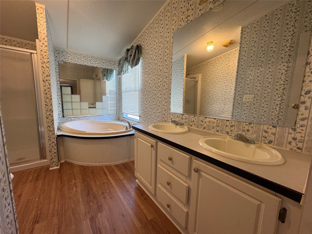 114 Speir Lane, Unit B Elgin, TX 78621 - Photo 10 of 11 a bathroom with a double vanity sink and mirror