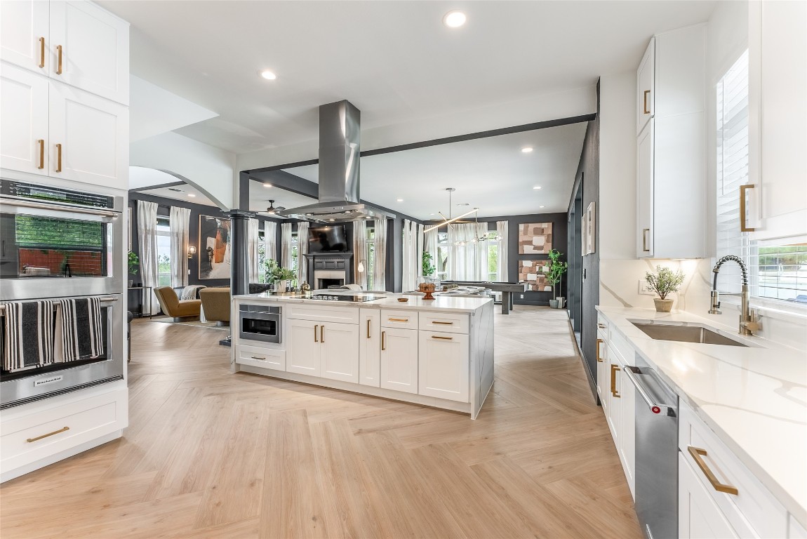 12605 Fitzhugh Road Austin, TX 78736 - Photo 13 of 40 a large white kitchen with lots of counter space a sink appliances and cabinets