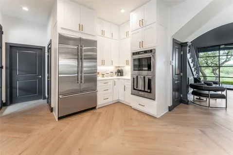 a spacious bathroom with a double vanity sink mirror double and bathtub