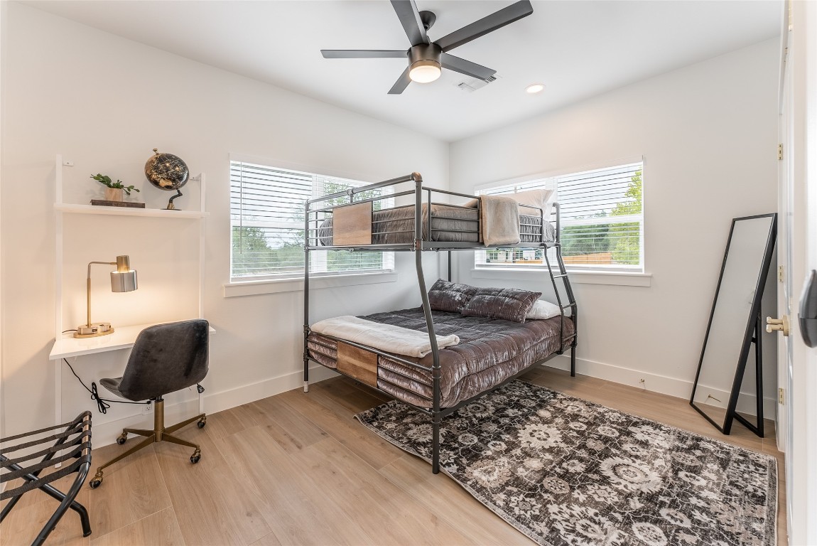 12605 Fitzhugh Road Austin, TX 78736 - Photo 19 of 40 a bedroom with a bed and a window