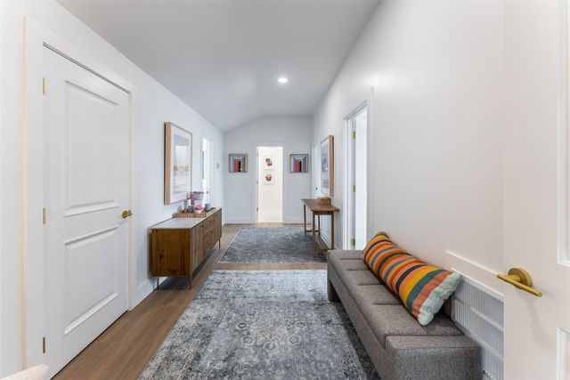 a bedroom with double bunk beds and a window