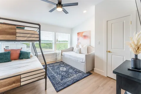 a bathroom with double vanity sink and two mirror