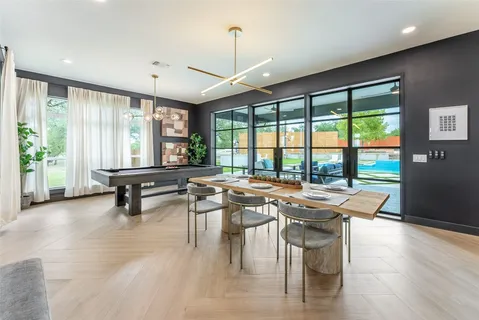a kitchen with stainless steel appliances a stove a sink and a refrigerator