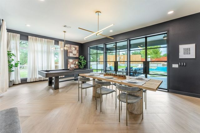 a kitchen with stainless steel appliances a stove a sink and a refrigerator