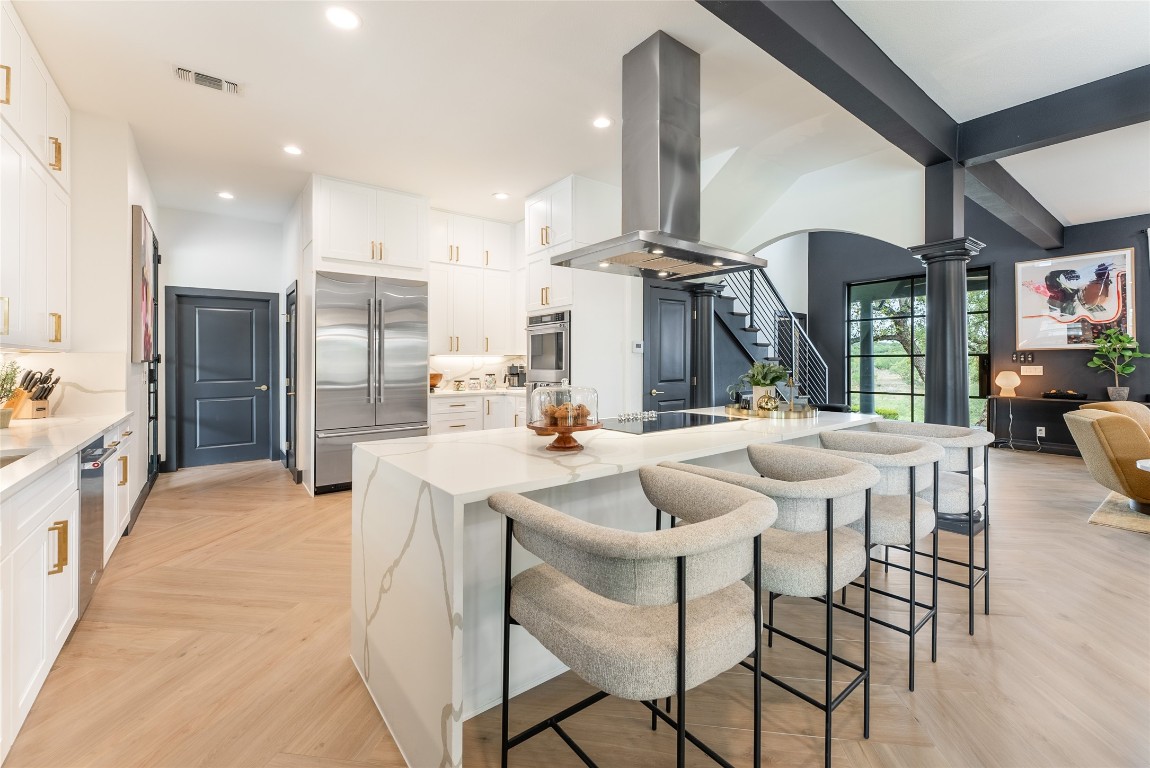 12605 Fitzhugh Road Austin, TX 78736 - Photo 10 of 40 a large kitchen with a table and chairs