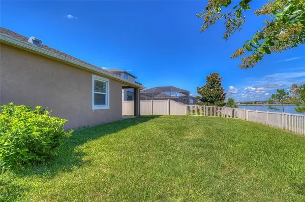 a view of backyard with garden and deck