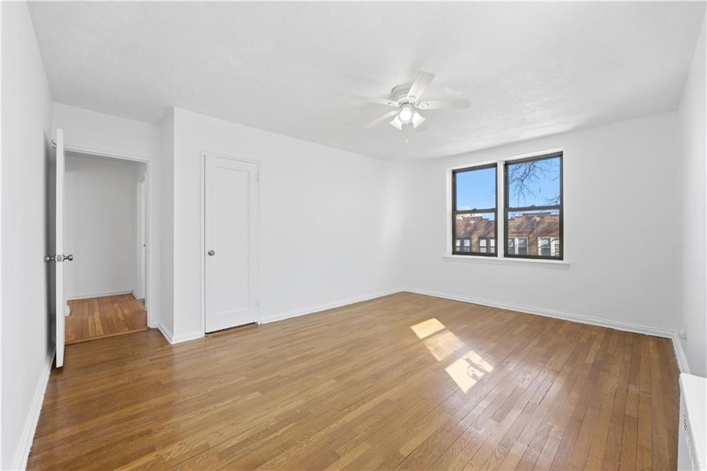 302 96th Street, Unit 3H Brooklyn, NY 11209 - Photo 7 of 14 a view of empty room with wooden floor