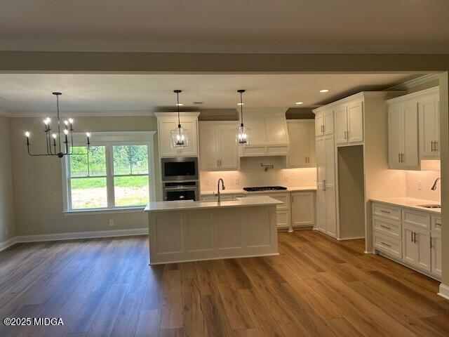 177 Camden Trace Macon, GA 31210 - Photo 4 of 19 a living room with stainless steel appliances kitchen island granite countertop a stove a refrigerator a sink a microwave oven with wooden floor and cabinets