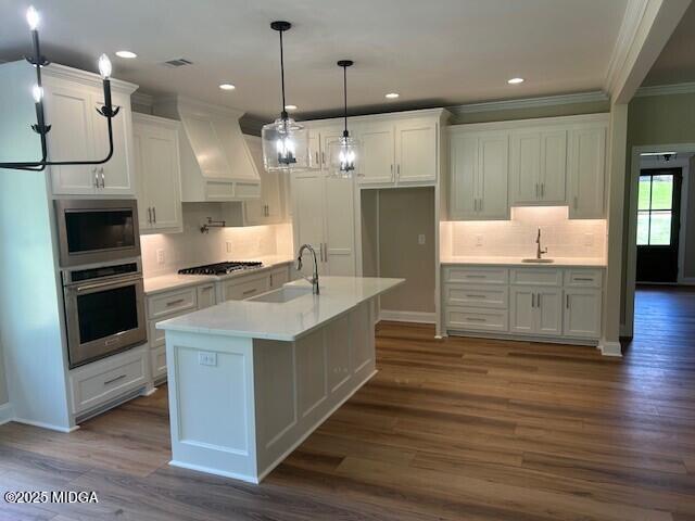 177 Camden Trace Macon, GA 31210 - Photo 5 of 19 a large kitchen with stainless steel appliances kitchen island granite countertop a sink a counter space and a view of living room