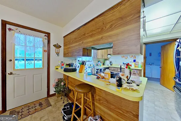 a view of a dining room with furniture window and entryway