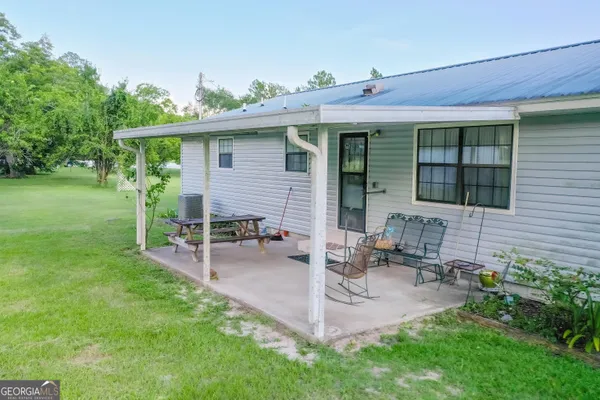 a front view of a house with patio