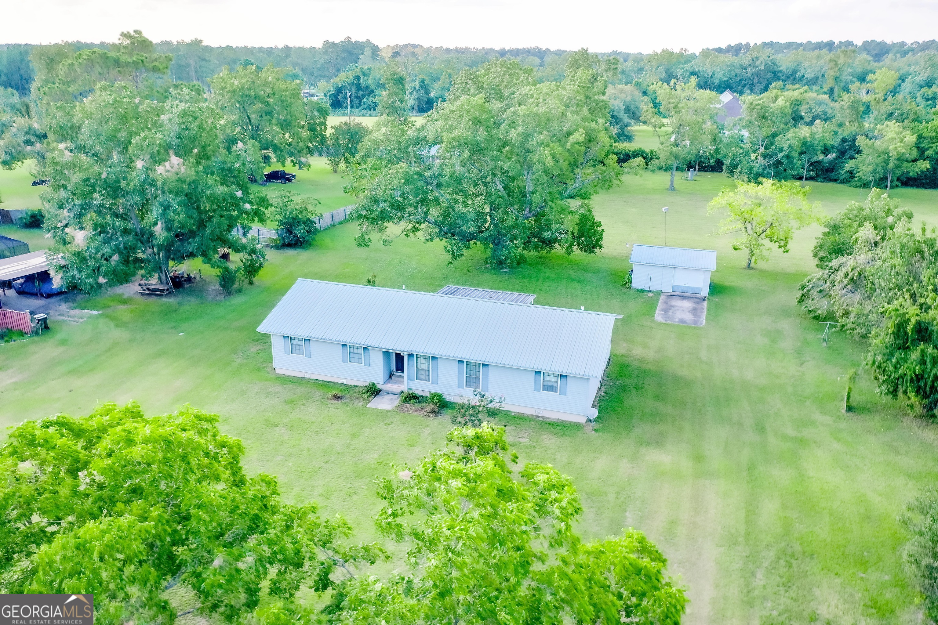 2142 Ben Couch Road Blackshear, GA 31516 - Photo 2 of 43 an aerial view of a house with pool a yard and a fountain