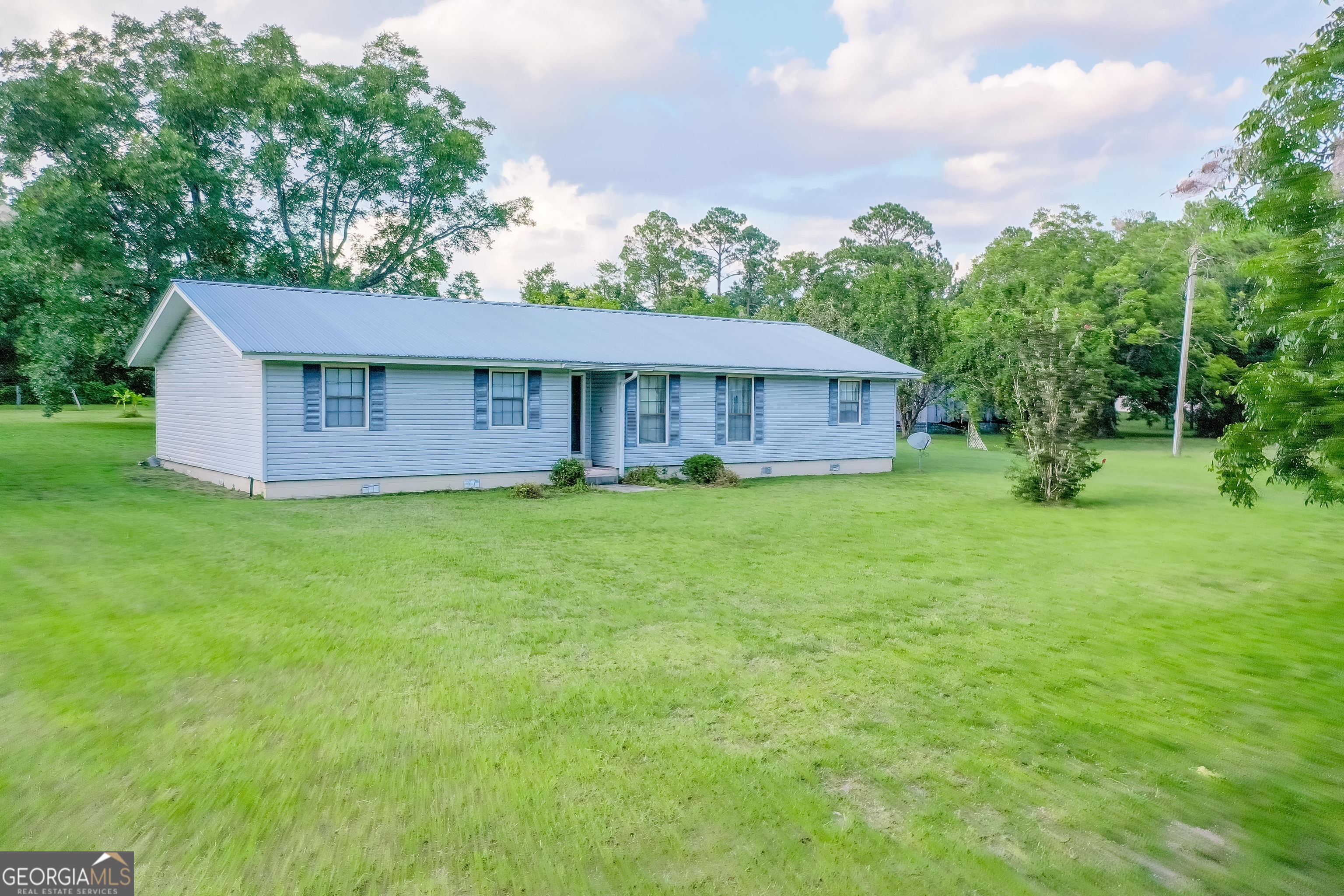 2142 Ben Couch Road Blackshear, GA 31516 - Photo 25 of 43 a house view with a garden space