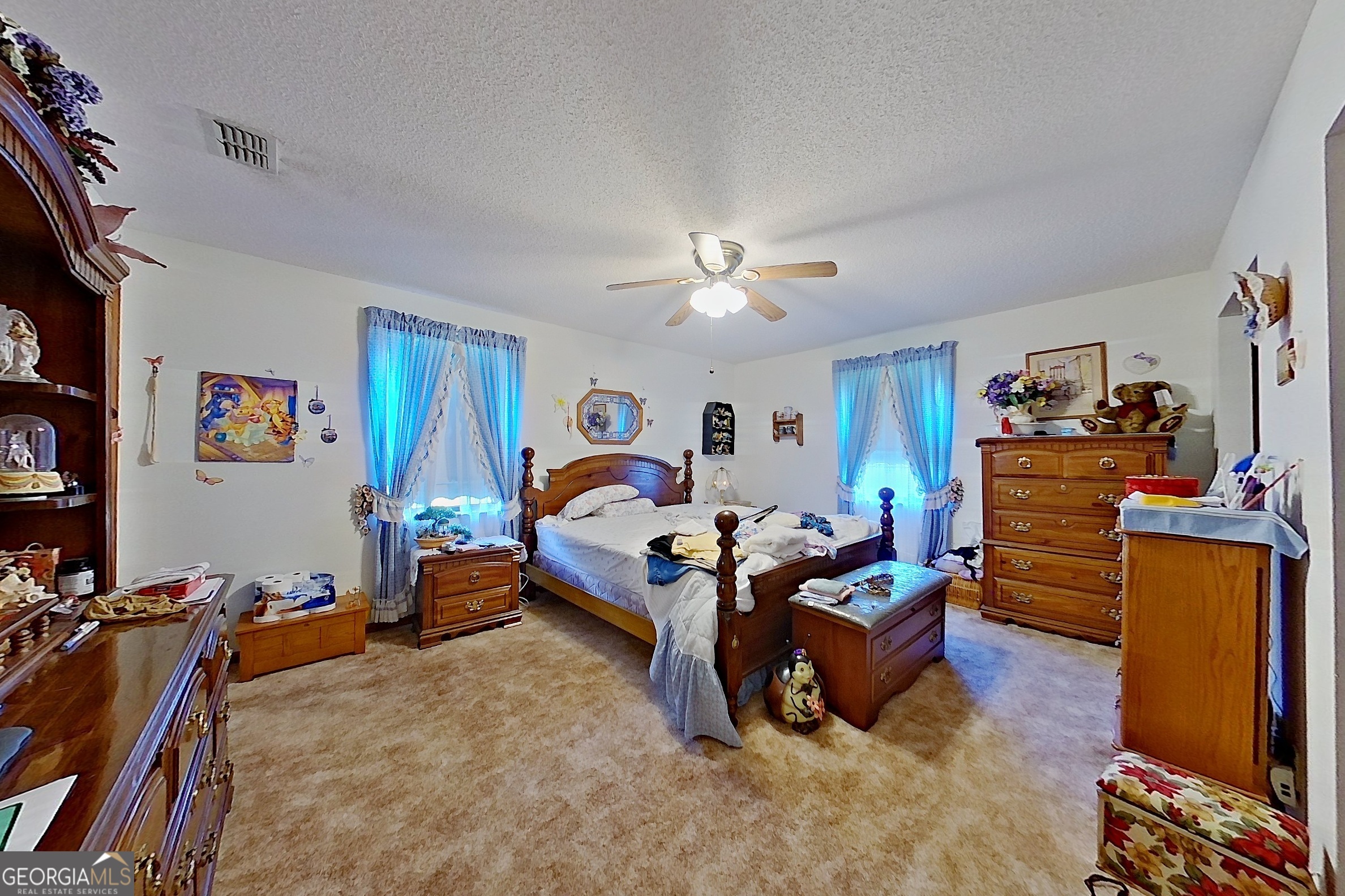 2142 Ben Couch Road Blackshear, GA 31516 - Photo 30 of 43 a bed room with furniture and a flat screen tv