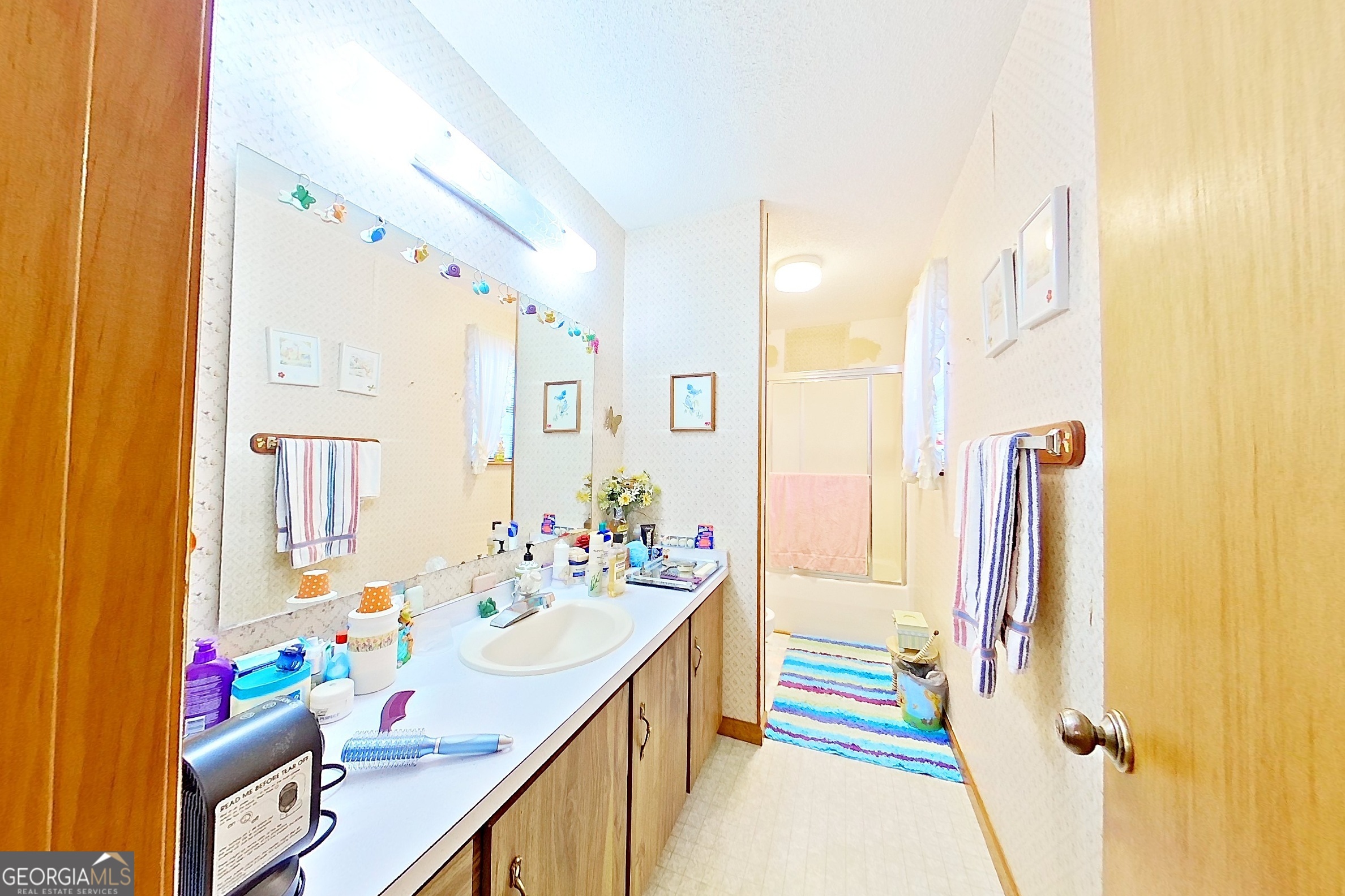 2142 Ben Couch Road Blackshear, GA 31516 - Photo 33 of 43 a bathroom with a sink mirror and vanity