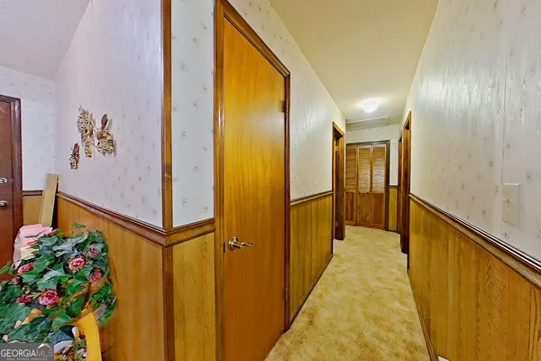 a bed room with a bed and a chandelier