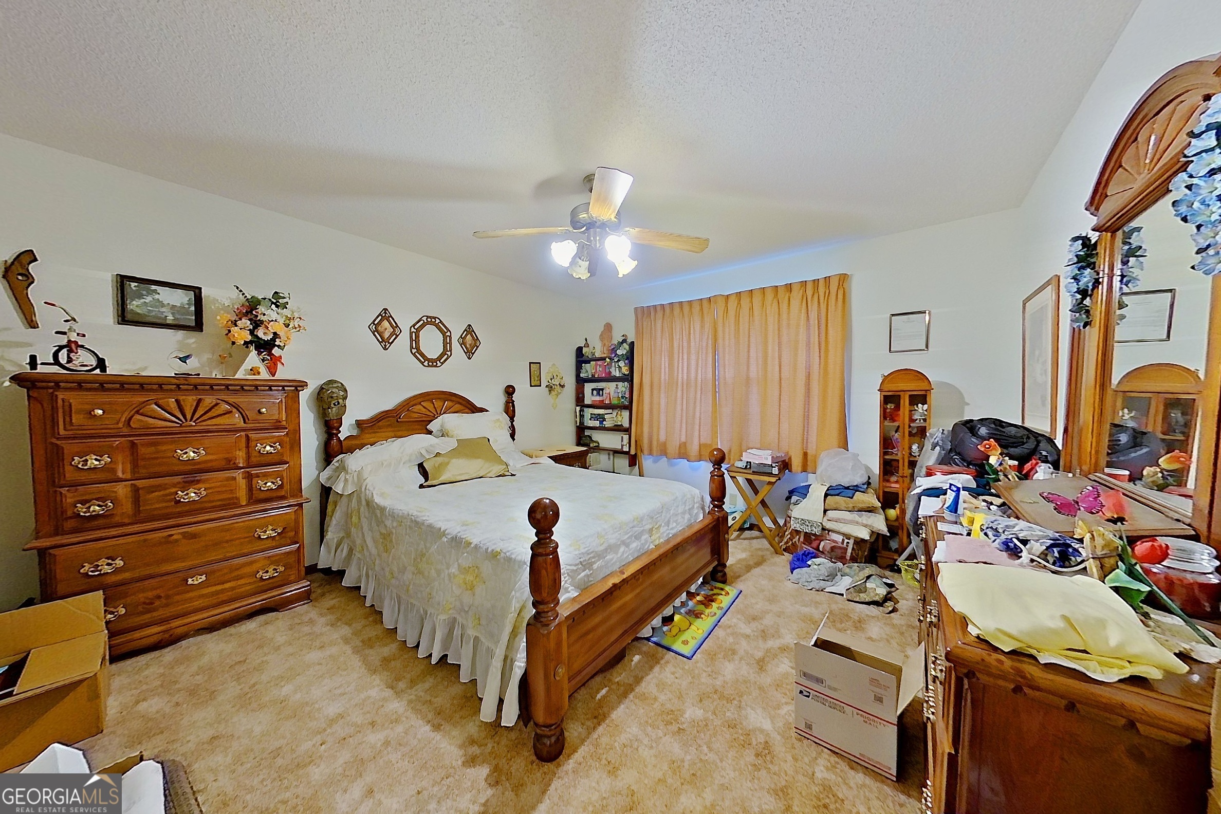 2142 Ben Couch Road Blackshear, GA 31516 - Photo 36 of 43 a bed room with a bed and a chandelier