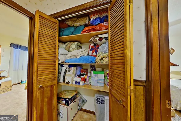 a room with toys and dresser with wooden floor