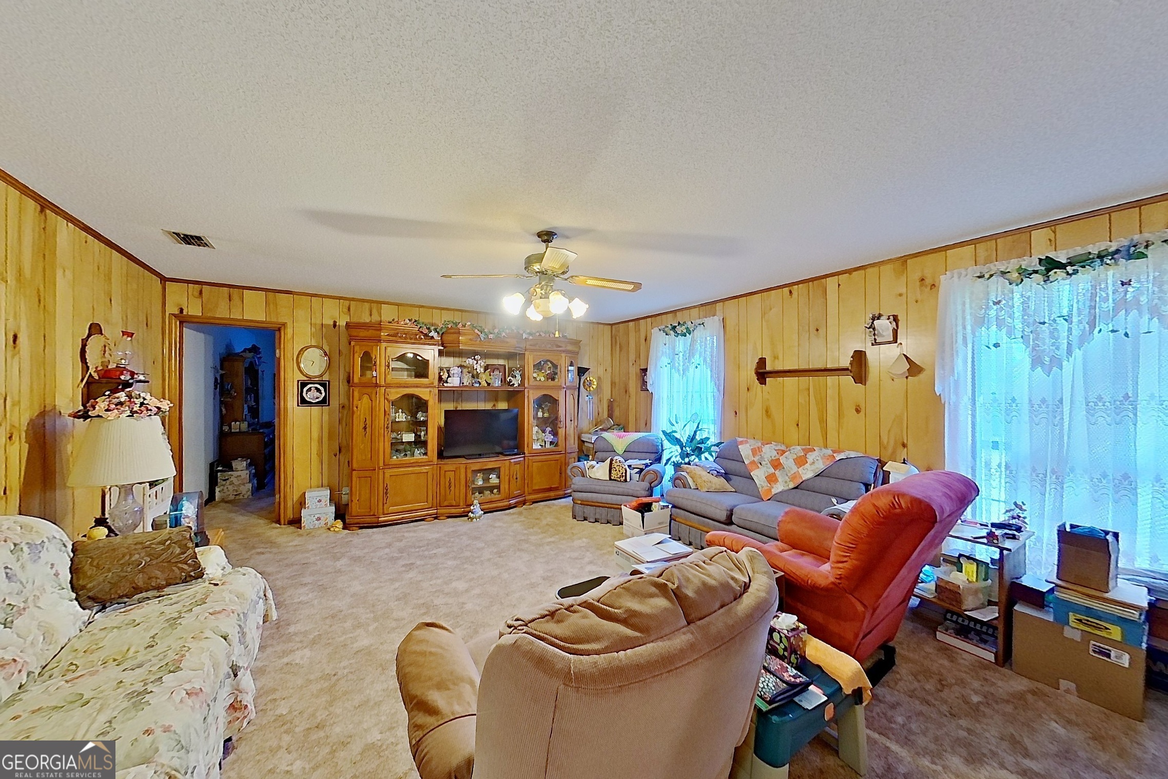 2142 Ben Couch Road Blackshear, GA 31516 - Photo 10 of 43 a living room with furniture a window and gym equipment