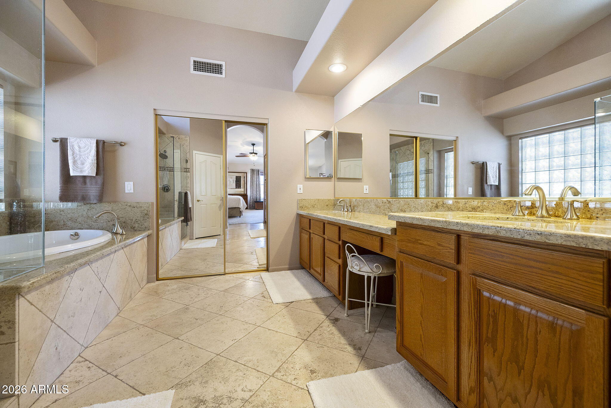12435 West Monte Vista Road Avondale, AZ 85392 - Photo 38 of 69 a large bathroom with a large tub and sink