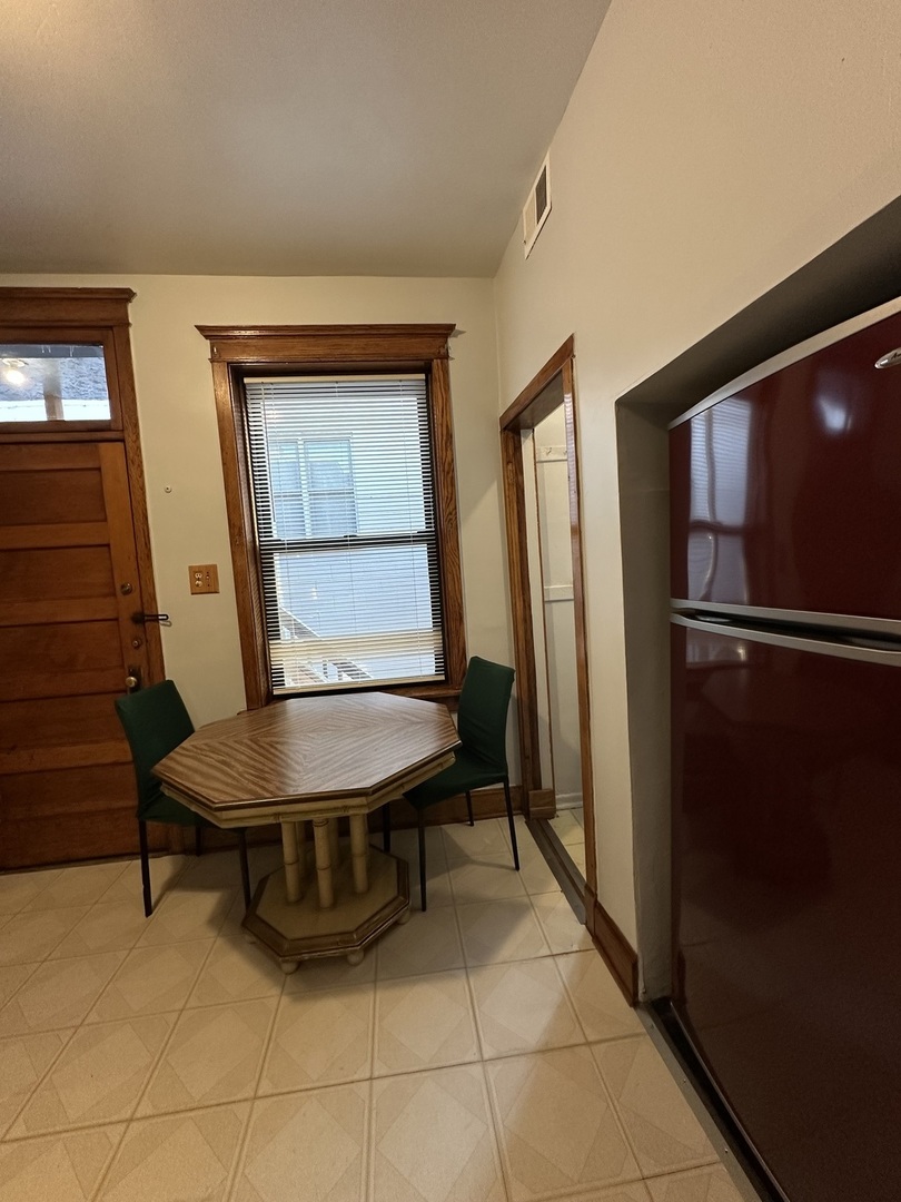 3759 North Damen Avenue, Unit 2 Chicago, IL 60613 - Photo 5 of 22 a room with furniture and a window