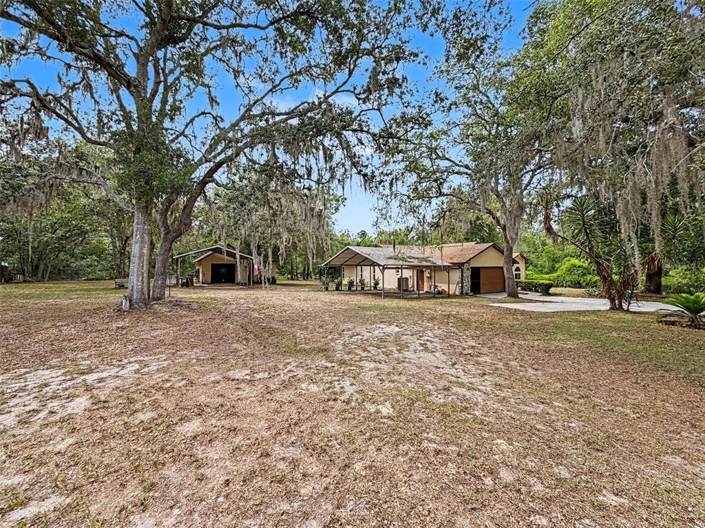 7111 Ricker Avenue Webster, FL 33597 - Photo 5 of 41 a view of a house with a yard