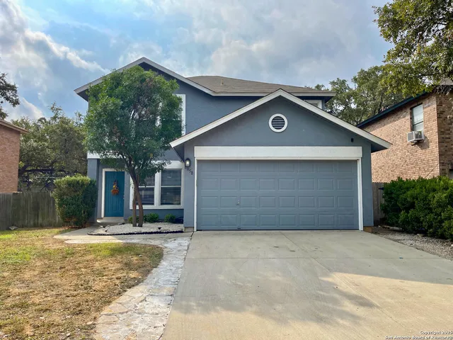 a house with trees in the background