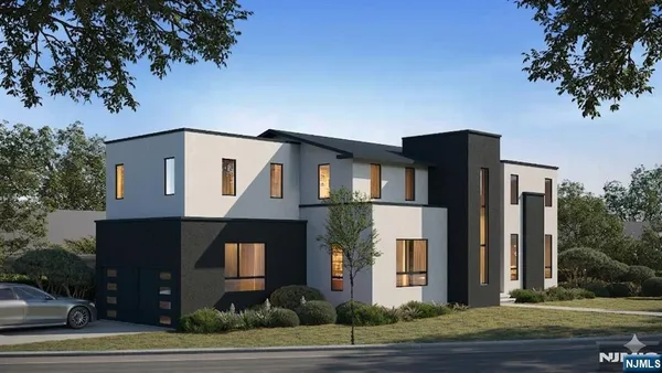 a front view of a house with a tree