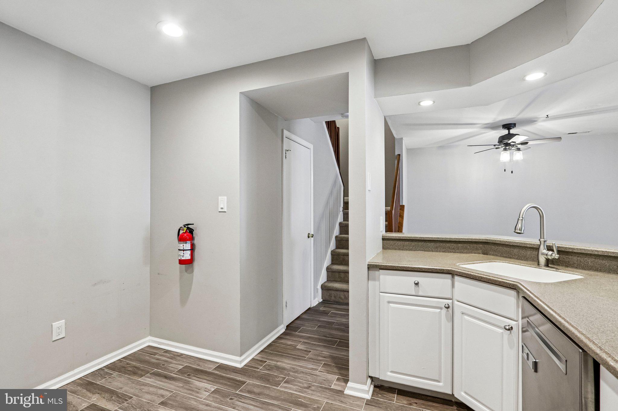 803 Wharton Road Mount Laurel, NJ 08054 - Photo 4 of 48 a view of a kitchen with a sink and wooden floor