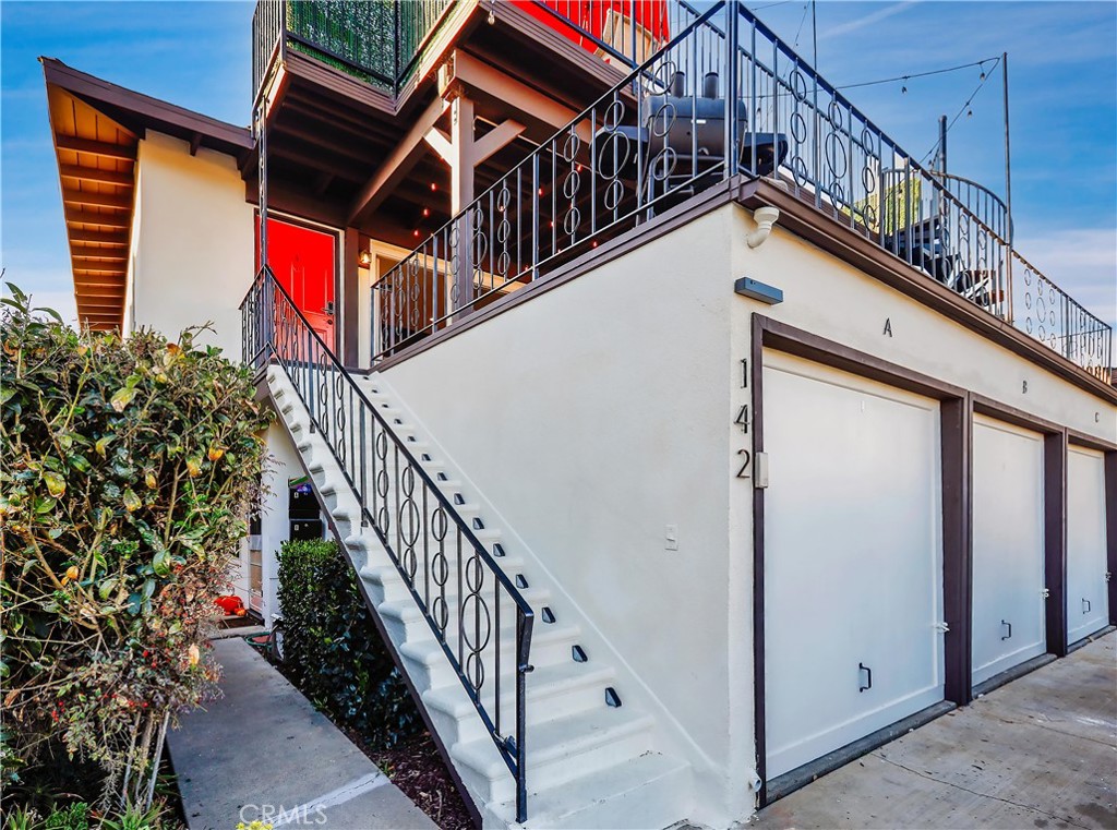 a view of balcony with wooden floor and fence