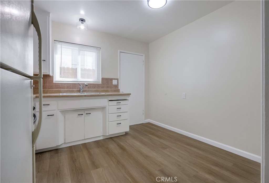 142 Avenida Pelayo, Unit B San Clemente, CA 92672 - Photo 12 of 26 an empty room with wooden floor