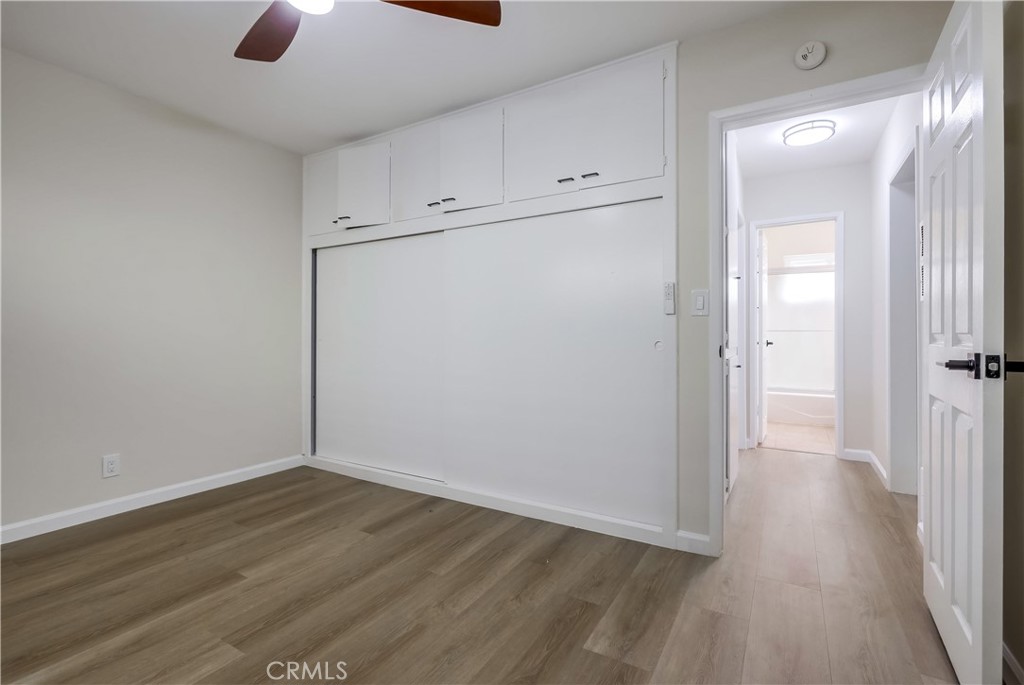 142 Avenida Pelayo, Unit B San Clemente, CA 92672 - Photo 13 of 26 an empty room with wooden floor