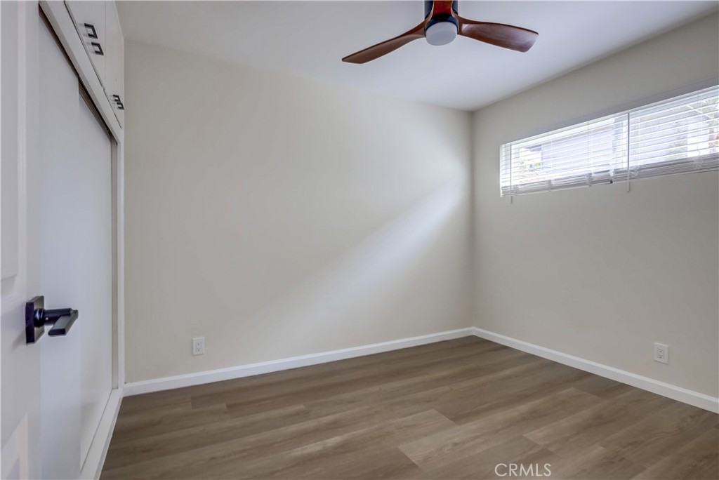 142 Avenida Pelayo, Unit B San Clemente, CA 92672 - Photo 19 of 26 wooden floor in an empty room with a window