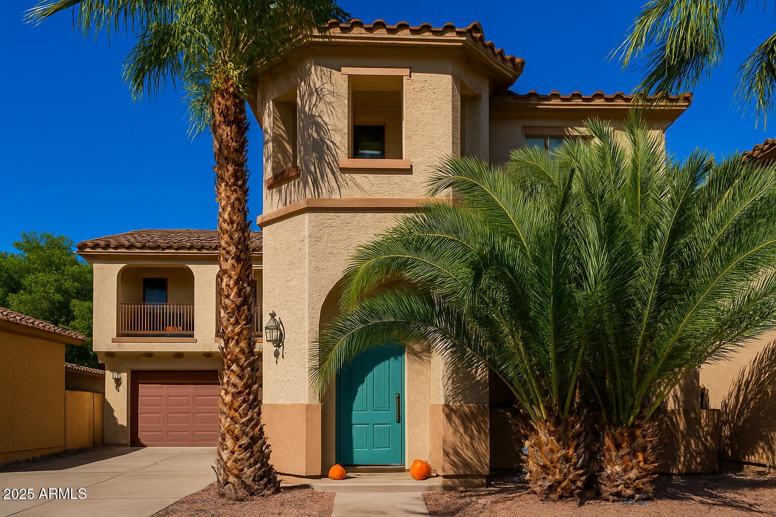 3802 East Chickadee Road Gilbert, AZ 85297 - Photo 1 of 29 a yellow house with trees in front of it