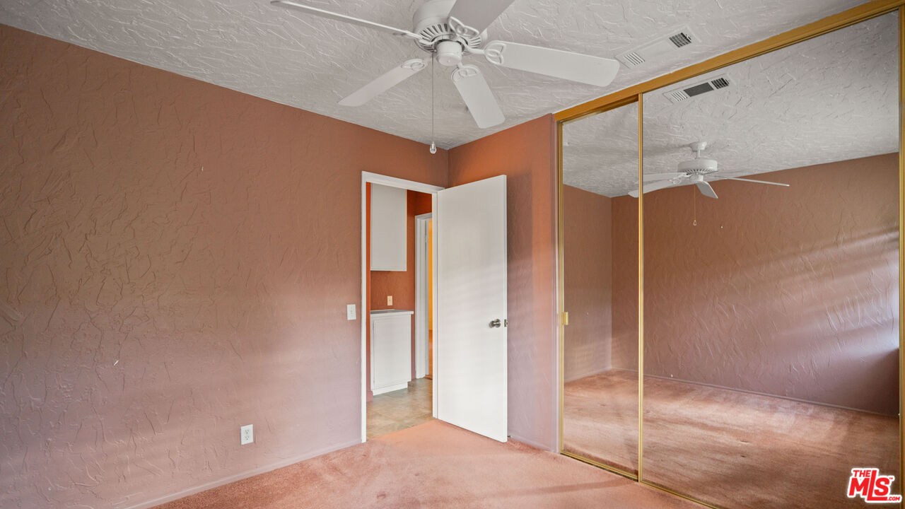 1592 South Compadre Road Palm Springs, CA 92264 - Photo 28 of 53 a bathroom with a shower and a glass door