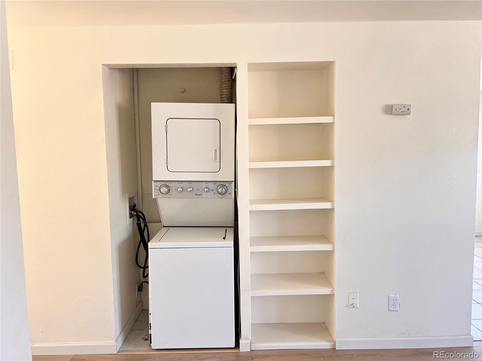 875 South Quebec Street, Unit 29 Denver, CO 80247 - Photo 6 of 13 a utility room with washer and dryer