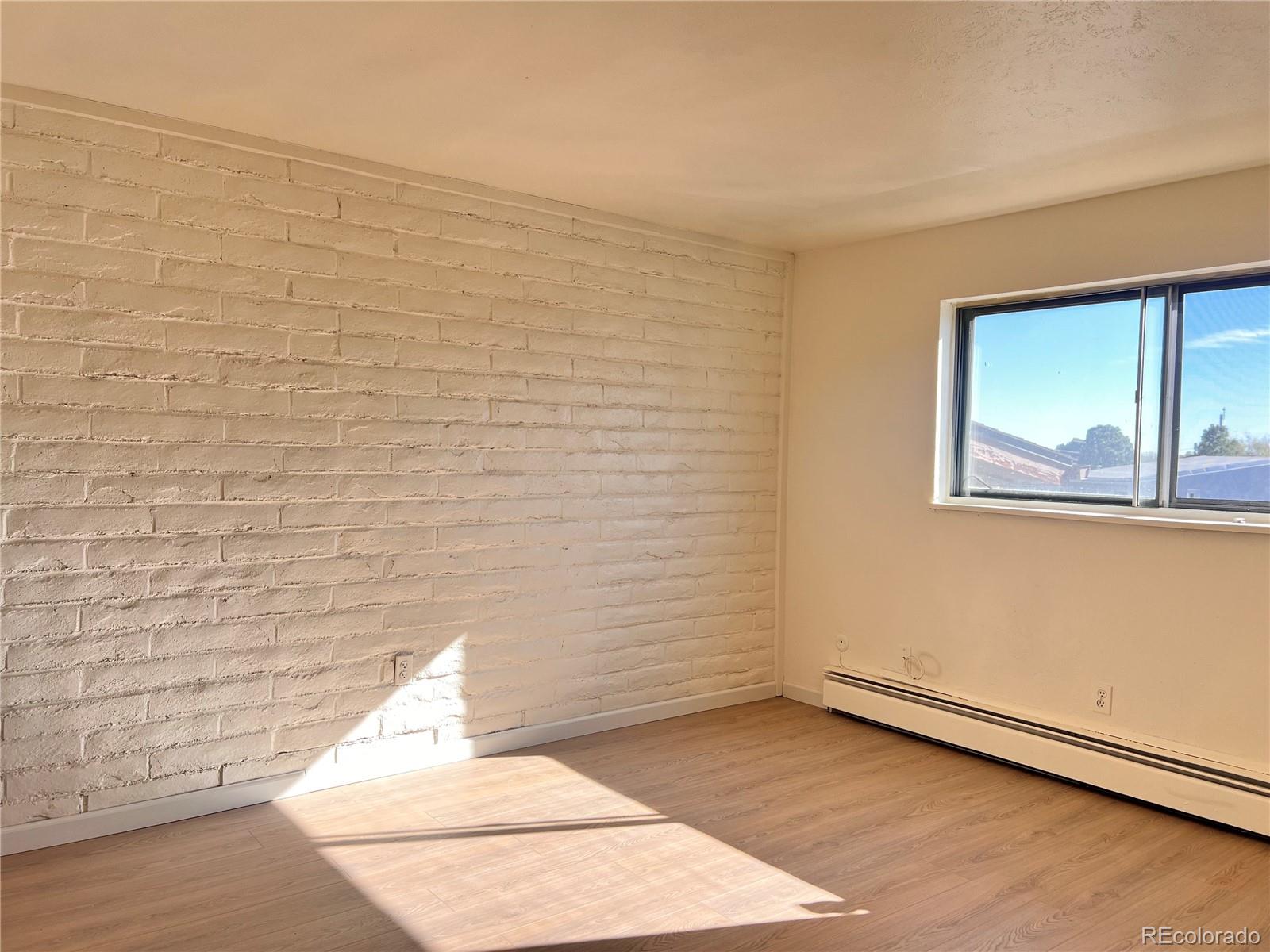 875 South Quebec Street, Unit 29 Denver, CO 80247 - Photo 10 of 13 a view of a room that has a window