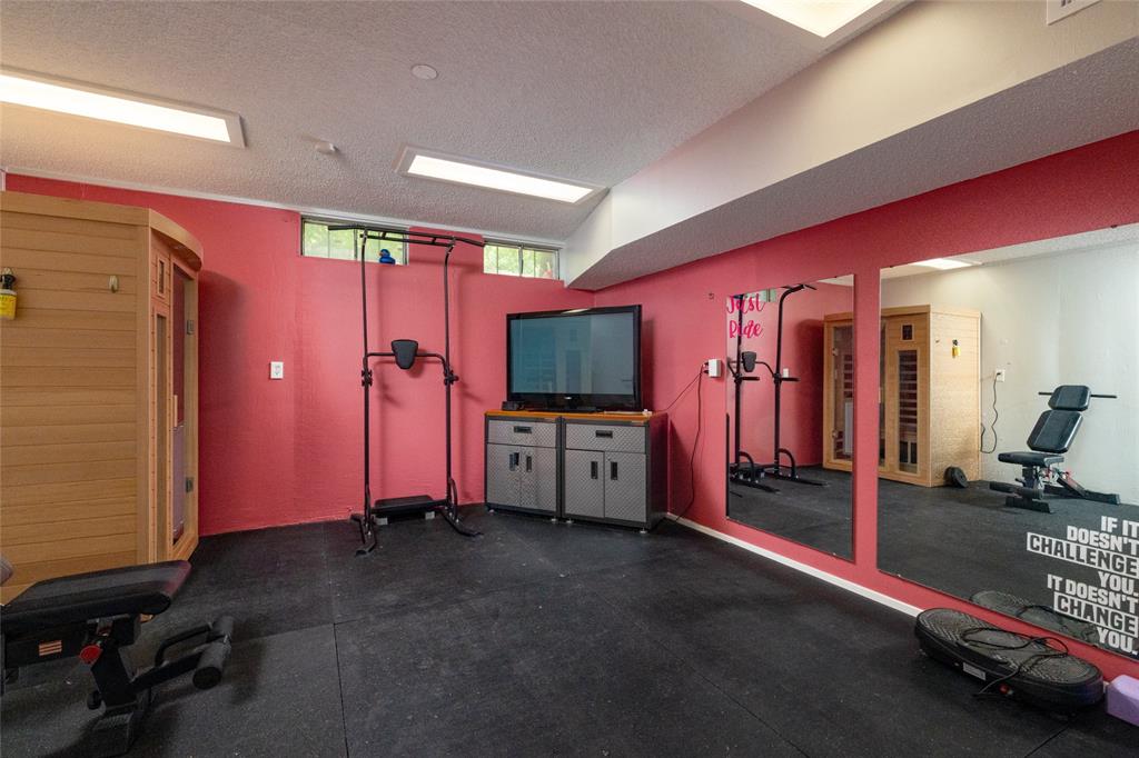 205 Timberlake Drive Azle, TX 76020 - Photo 27 of 40 a view of a livingroom with gym equipment