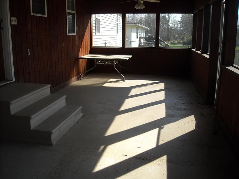 screened-in back porch with ceiling fans