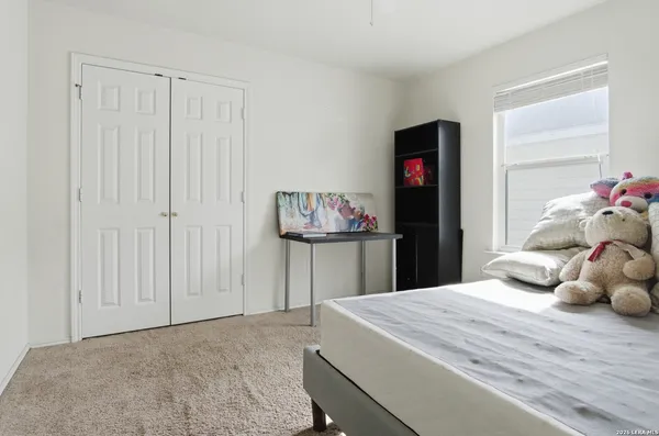 a room with a bed and a window