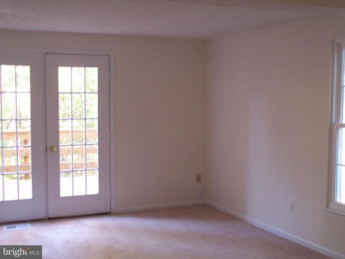 11930 Fieldthorn Court Reston, VA 20194 - Photo 6 of 12 an empty room with windows