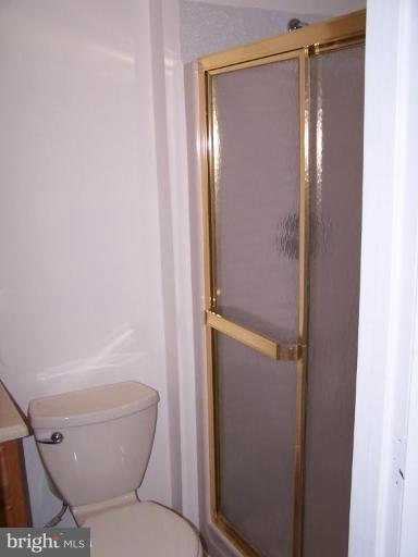 11930 Fieldthorn Court Reston, VA 20194 - Photo 8 of 12 a bathroom with a toilet and a shower
