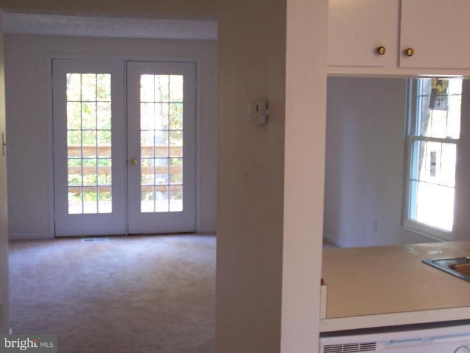 11930 Fieldthorn Court Reston, VA 20194 - Photo 9 of 12 an empty room with windows