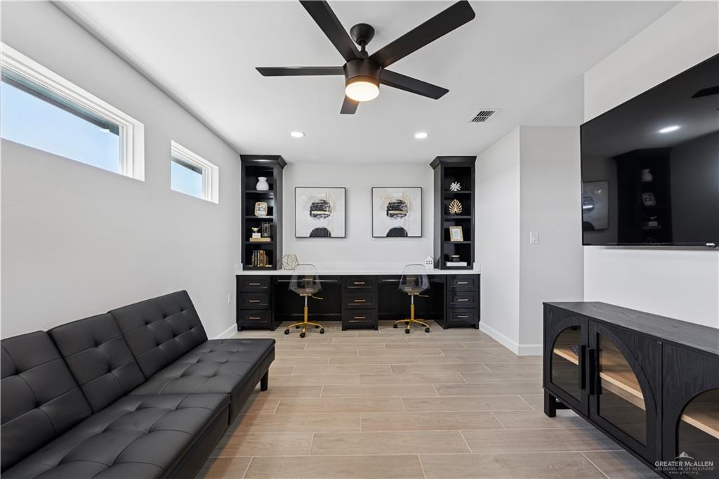 1013 Azalea Street Mission, TX 78573 - Photo 25 of 35 Office space with built in study area, wood finish floors, a ceiling fan, and recessed lighting