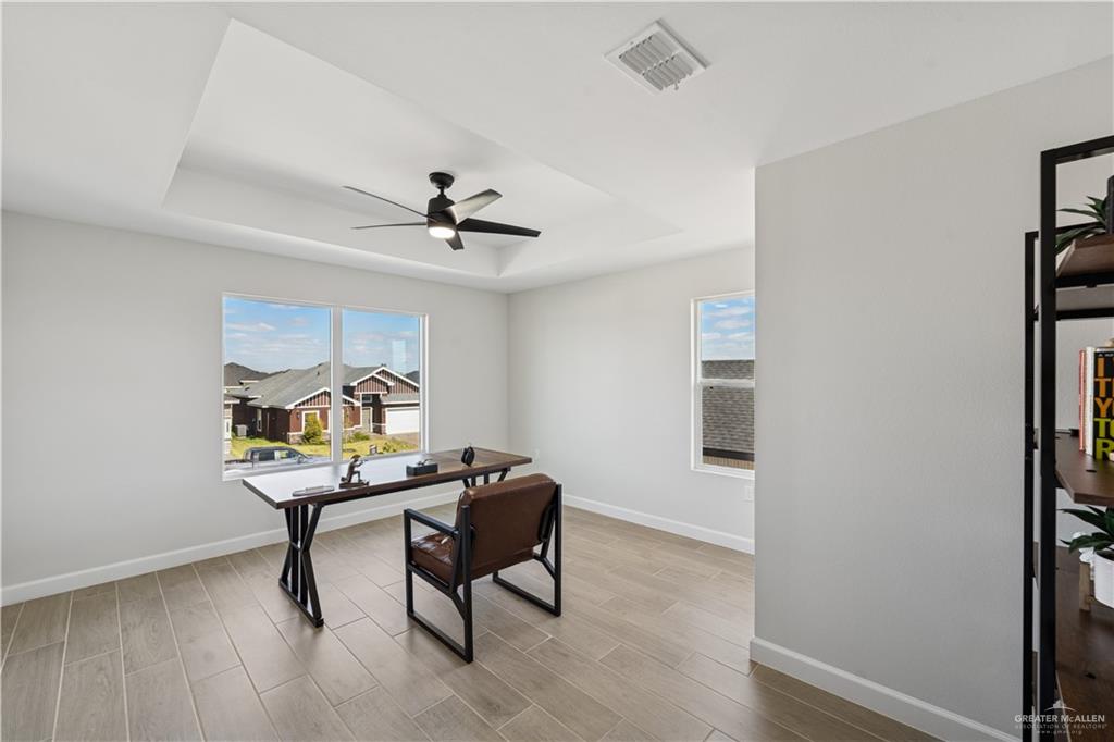 1013 Azalea Street Mission, TX 78573 - Photo 32 of 35 Office space featuring a raised ceiling, light wood finished floors, and healthy amount of natural light