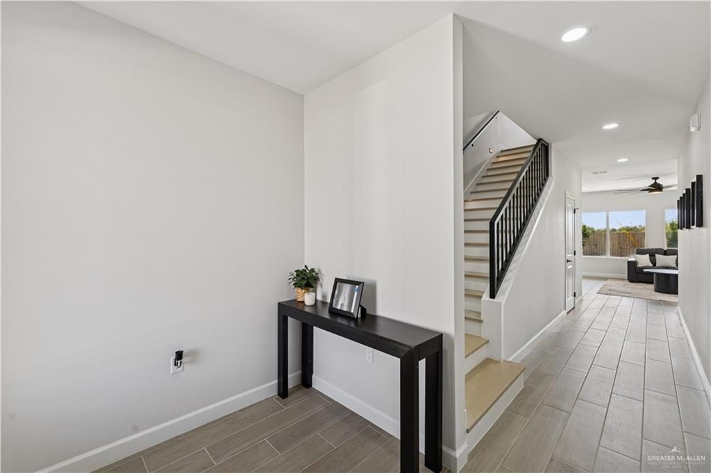 1013 Azalea Street Mission, TX 78573 - Photo 5 of 35 Hall with wood tiled floors, stairway, and recessed lighting
