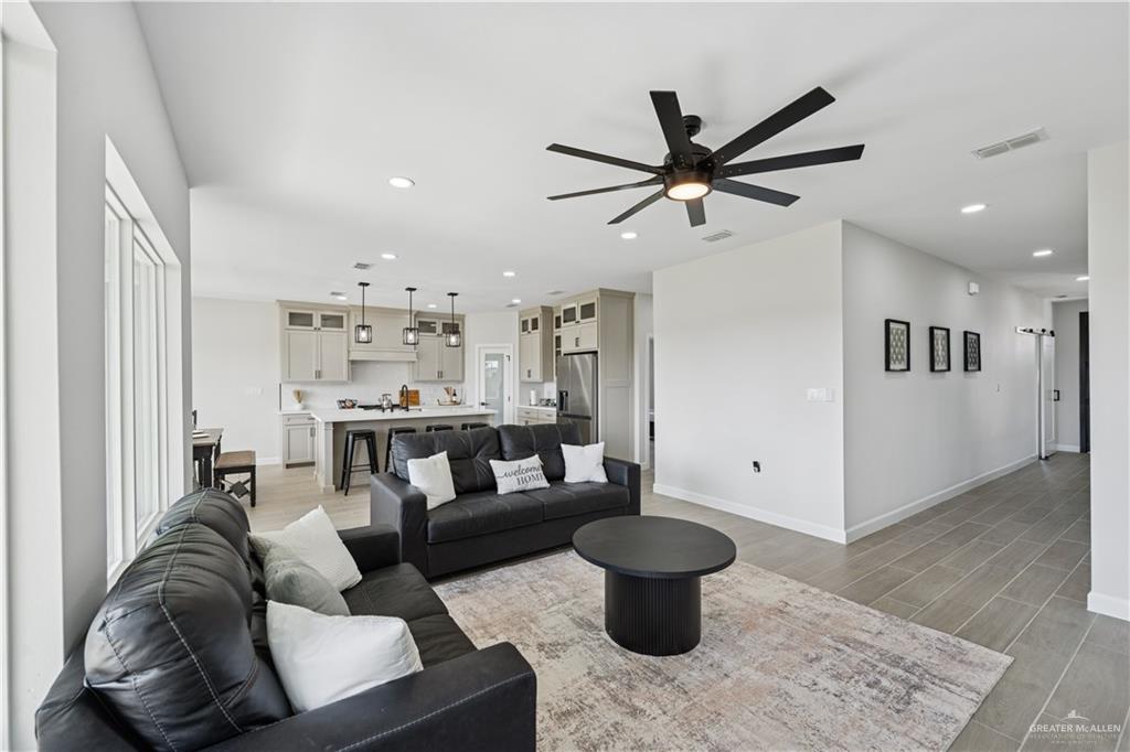 1013 Azalea Street Mission, TX 78573 - Photo 7 of 35 Living area featuring light wood-style flooring, recessed lighting, and ceiling fan